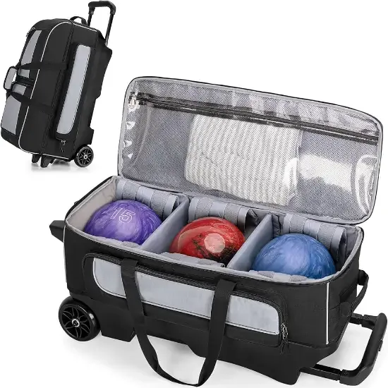 An open three-ball roller bag in black and grey with three balls in individual wells and a pull handle extended beside a second bag on wheels