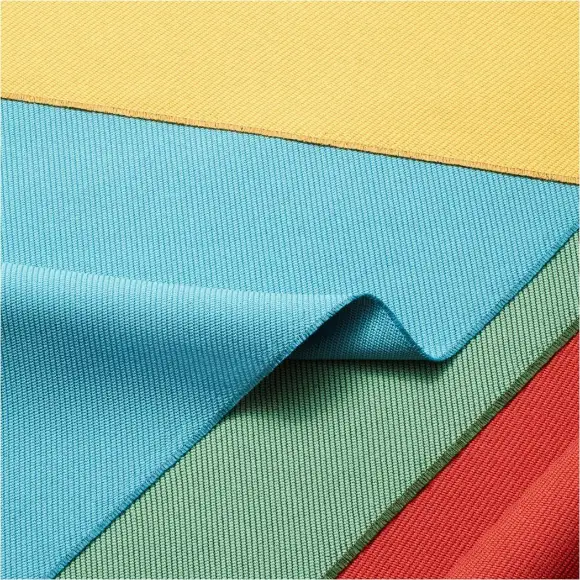 Lengths of recycled PET fabric in yellow, blue, green and red laid in overlapping bands