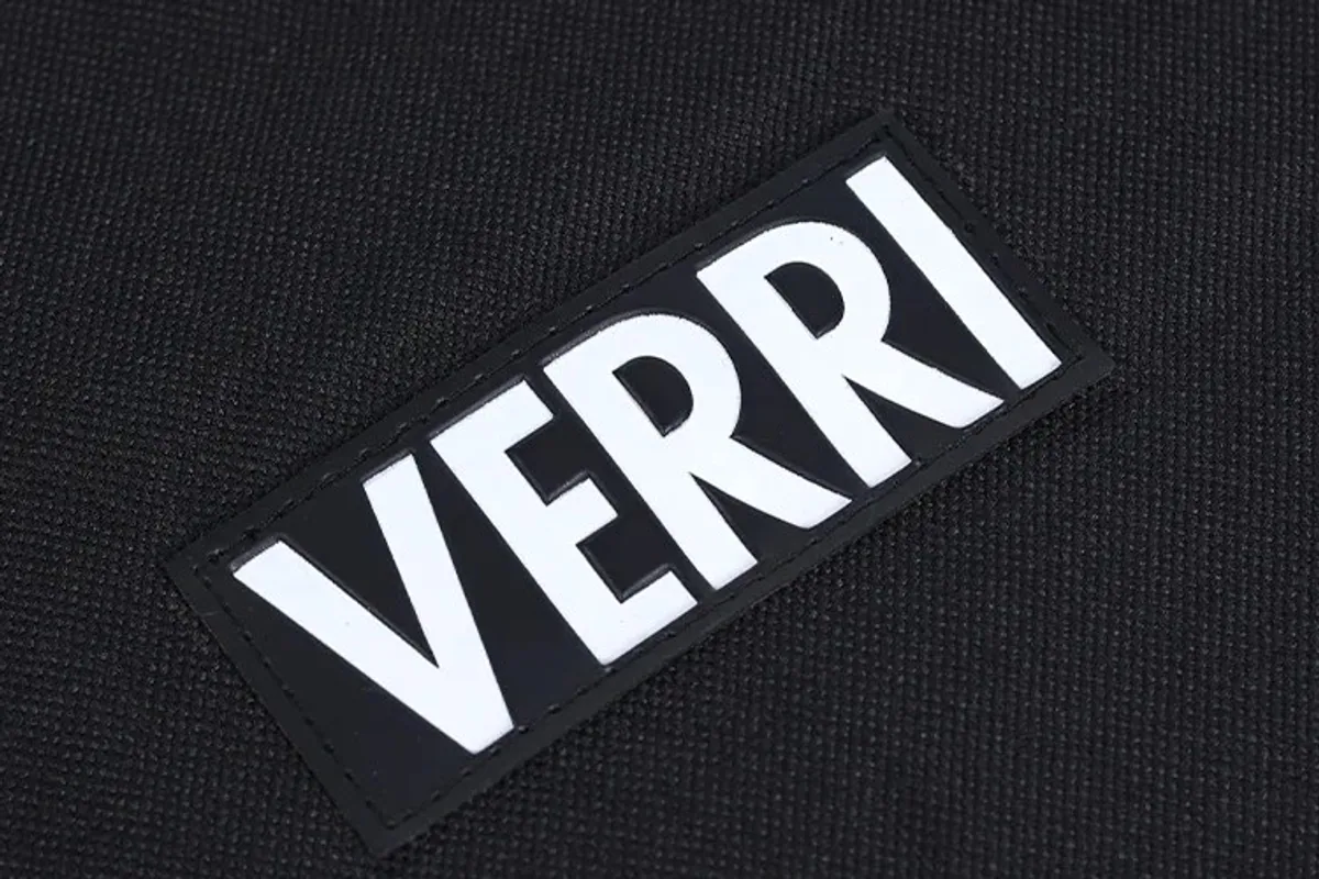 A custom woven logo label sewn onto a garment bag
