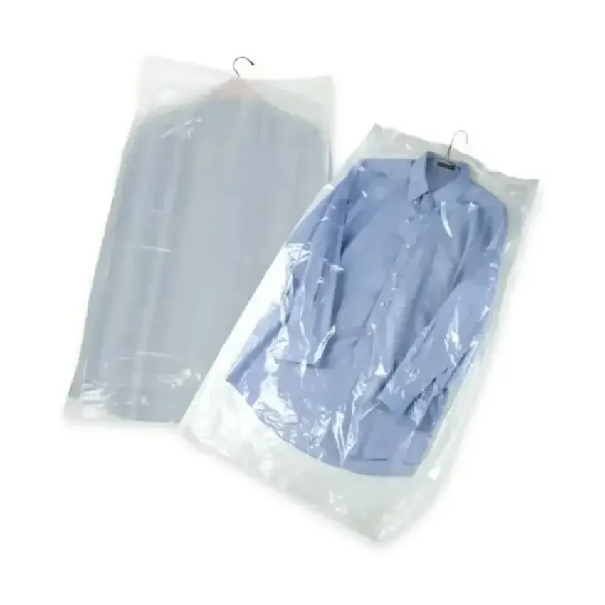 Two thin polyethylene garment covers, one empty and one over a folded shirt, showing the transparent film
