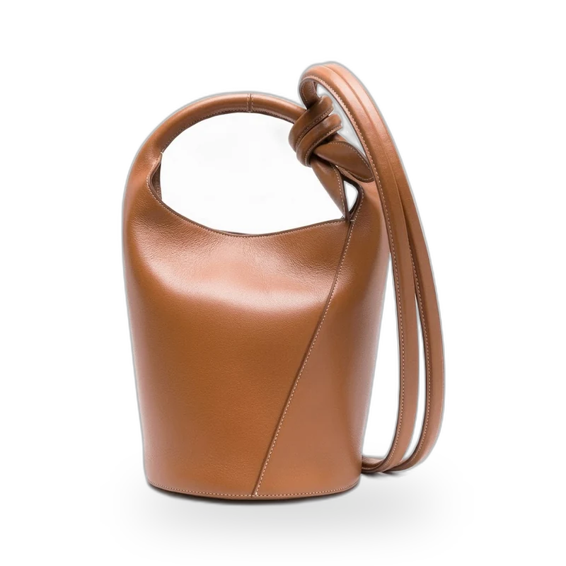 A tan leather bucket bag with a knotted handle