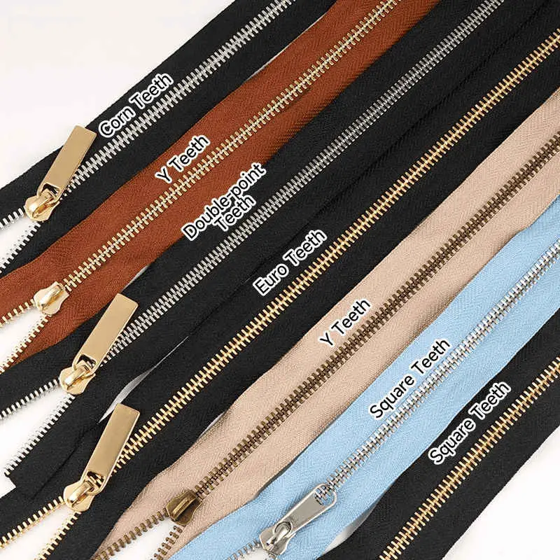 A fan of leather zipper tapes with gold, silver and gunmetal teeth labelled by tooth profile