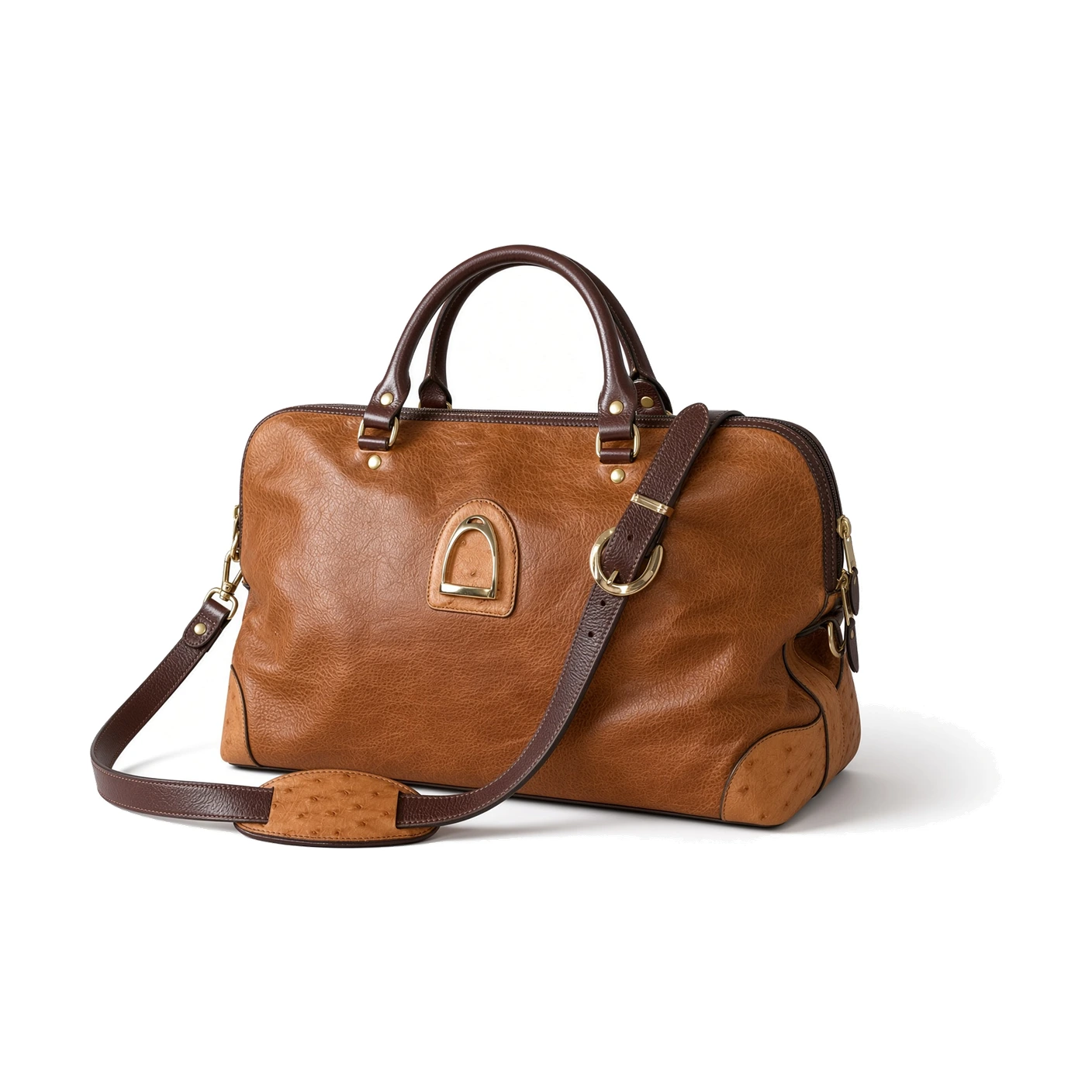 A tan pebbled-leather bag with dark-brown handles, a crossbody strap and gold hardware