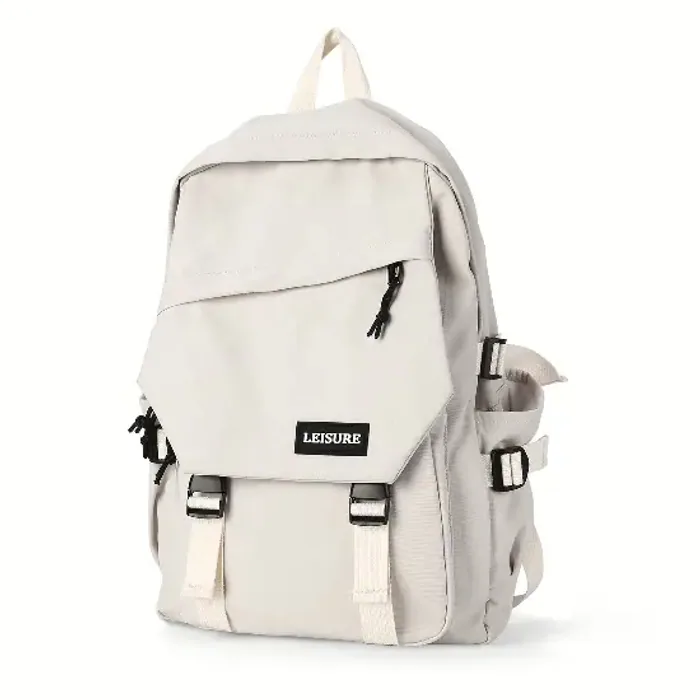 A cream school backpack with a top handle, a zipped front pocket and buckled lid straps down the face