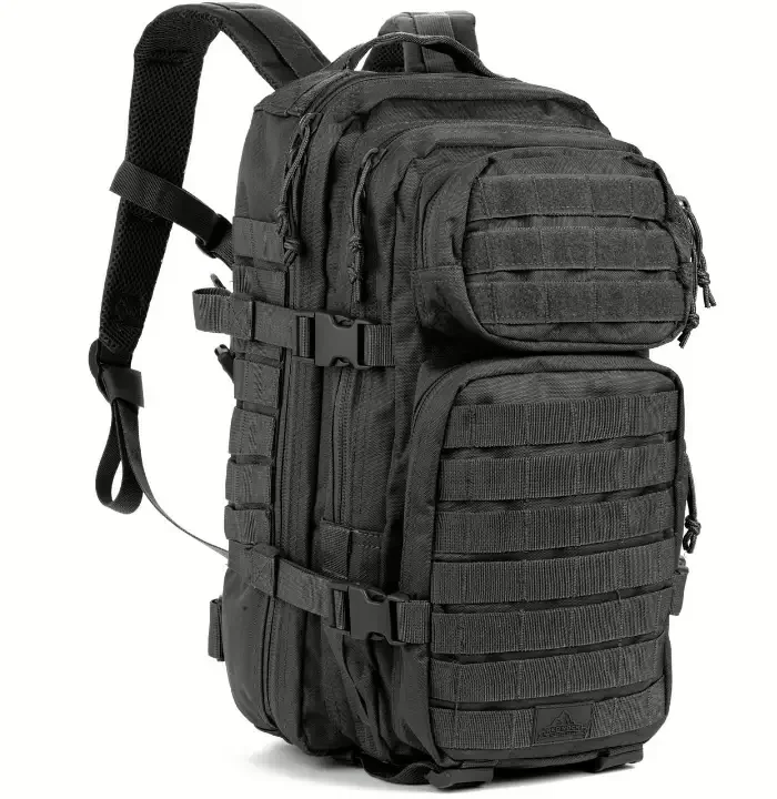 A black custom assault backpack with three stacked front pouches, their faces cut as MOLLE webbing, and side compression buckles