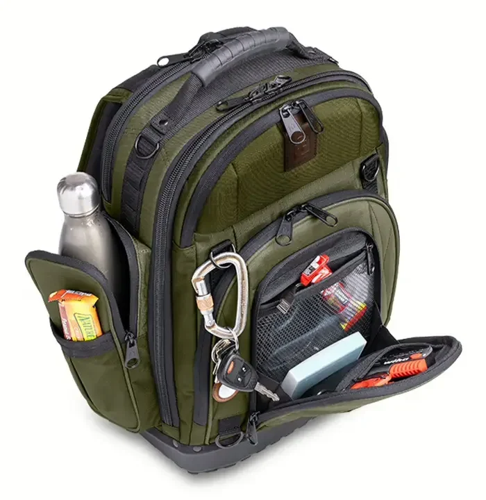 An olive everyday-carry pack with a concealed admin panel dropped open to a red interior and a side pocket holding a bottle upright
