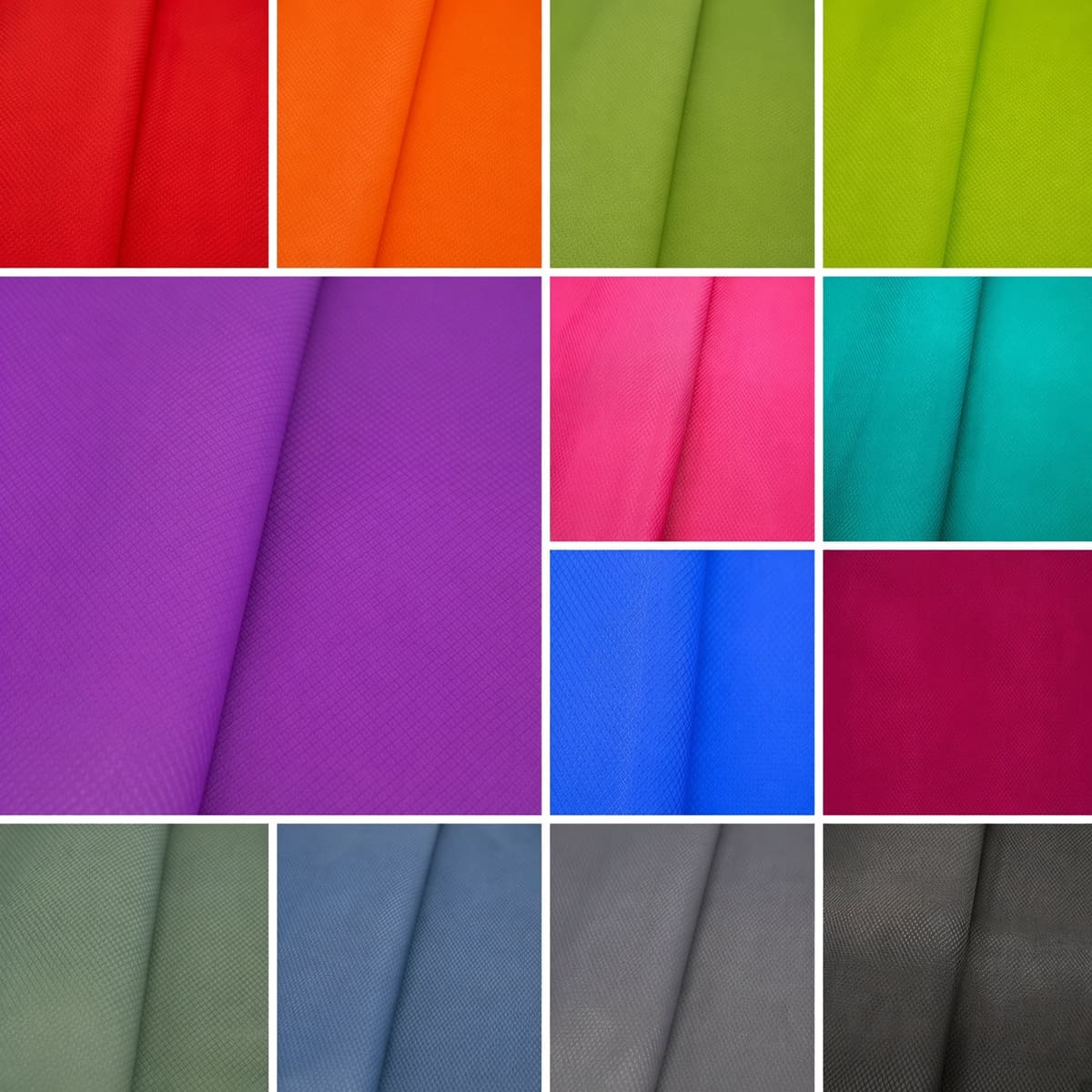 A grid of cloth panels in a wide range of dyed colours, red through purple, blue, green and grey