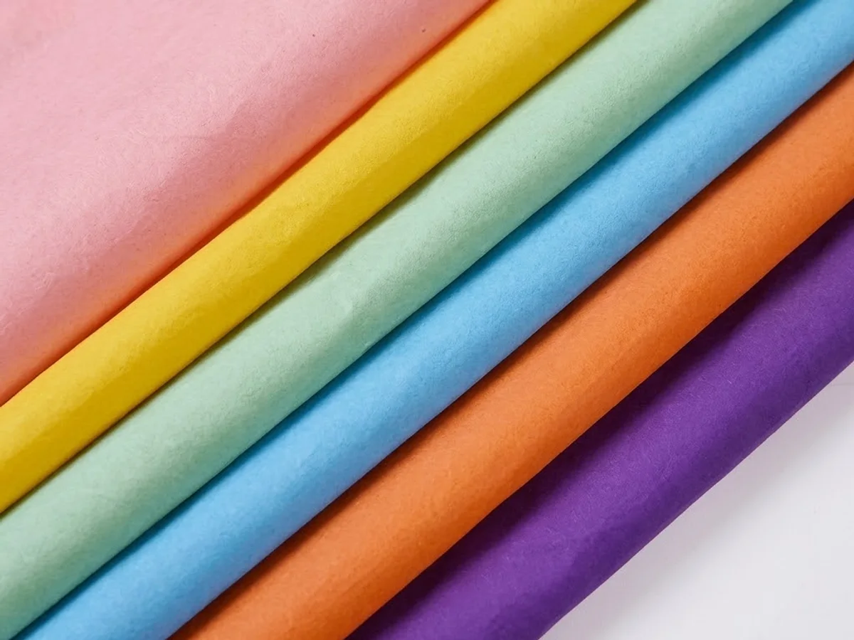 Fan-folded nylon in a range of colours, photographed to show its even sheen