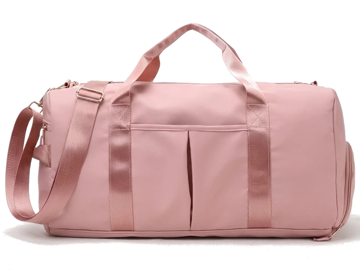 A pink coated polyester travel duffel photographed on a plain ground