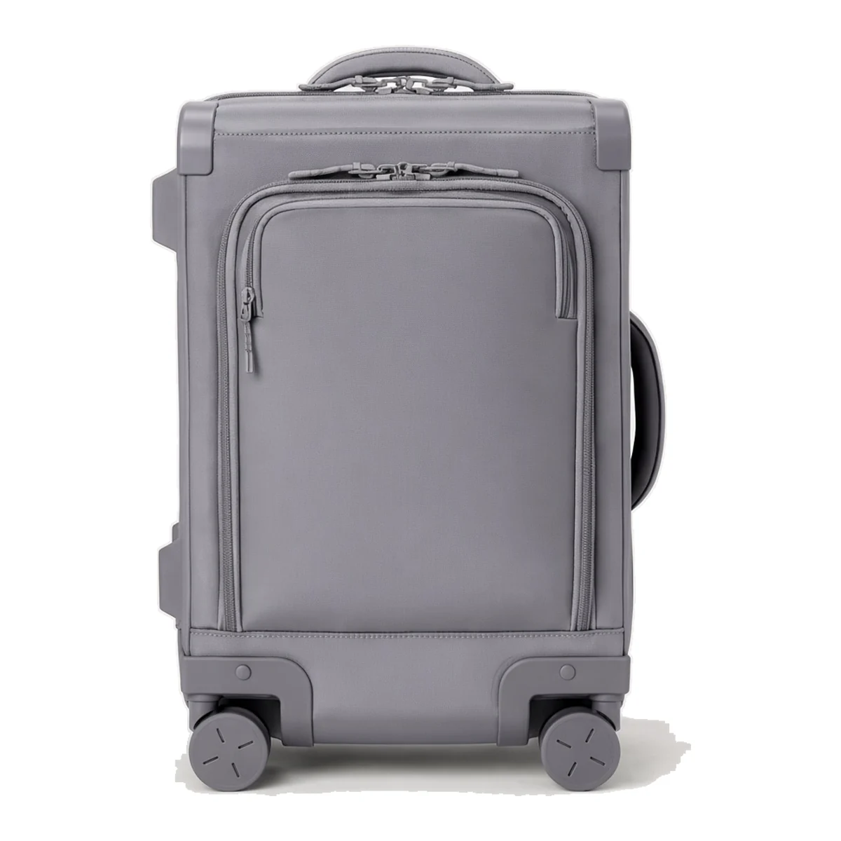 A custom softside suitcase standing on four spinner wheels with a zipped front pocket
